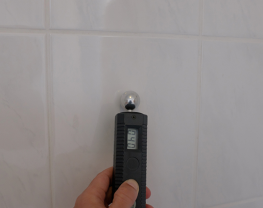 Damp specialist carrying out a damp survey in Sussex using diagnostic equipment