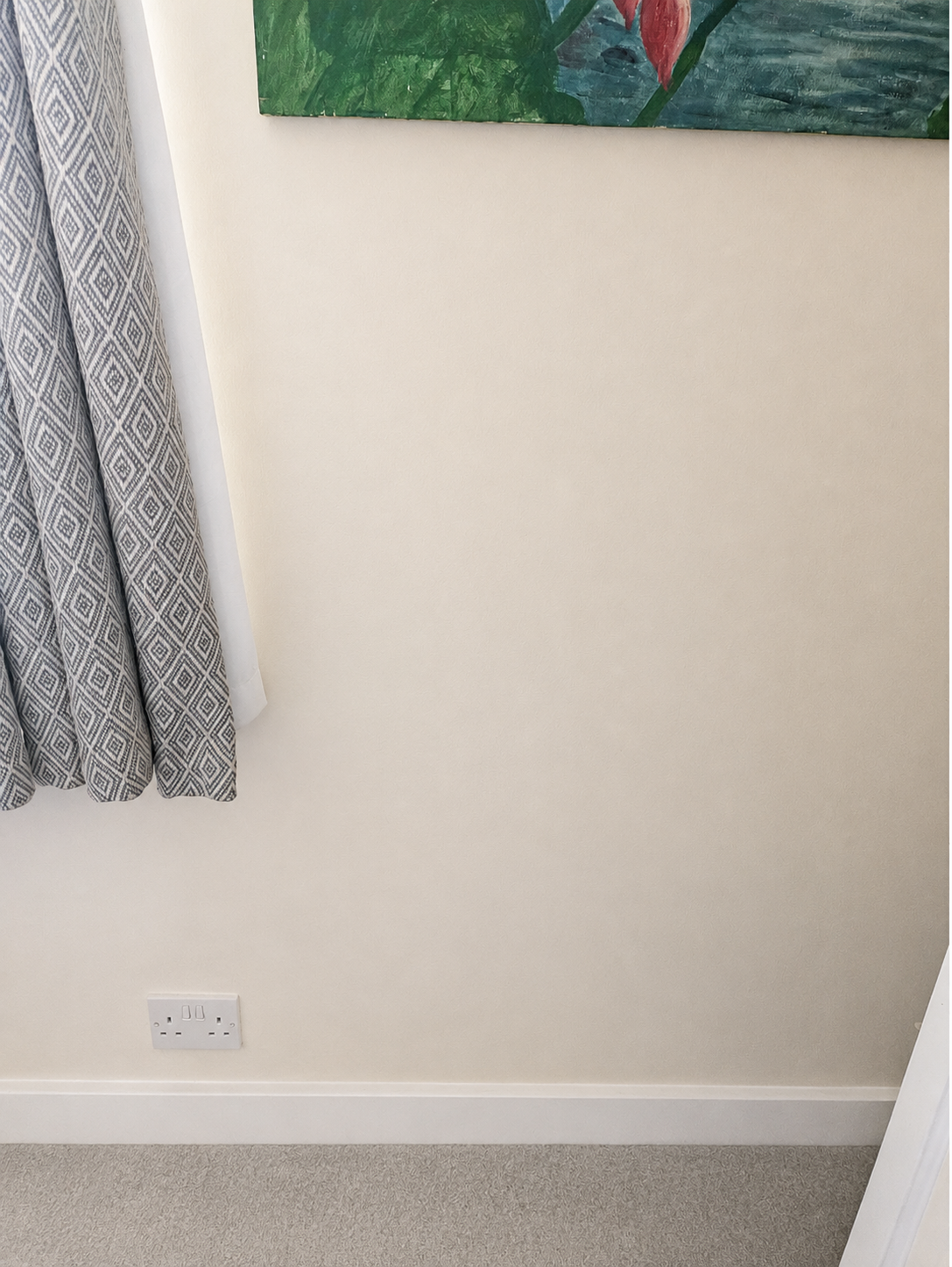 The same wall repaired, dry, redecorated and cleared of clutter. Interior wall repaired and redecorated after penetrating damp remedial work